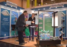 Jonathan helps a visitor at the booth of Climalux.